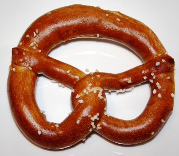 Dipping pretzels in lye increases the rate of the Maillard reaction